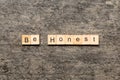 be honest word written on wood block. be honest text on table, concept Royalty Free Stock Photo