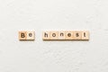 be honest word written on wood block. be honest text on table, concept Royalty Free Stock Photo
