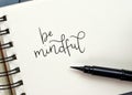 BE MINDFUL hand-lettered in notepad Royalty Free Stock Photo