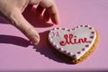 Be Mine, hand and gingerbread biscuit with icing sugar