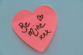 Be Mine hand wrote text on pink love heart with drawn hearts. On white isolated background. Love Valentines concept