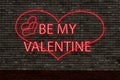 be my valentine neon sign on brick wall