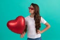 be my valentine. teen girl with party balloon. love present. serious kid with love romantic gift Royalty Free Stock Photo