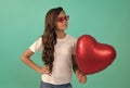 be my valentine. teen girl with party balloon. love present. serious kid with love romantic gift Royalty Free Stock Photo