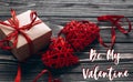 Be my valentine text sign. stylish present and two red hearts wi Royalty Free Stock Photo