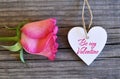 Be my Valentine.Valentines Day greeting card.Rose and decorative white heart on old wooden background.St.Valentine`s Day concept. Royalty Free Stock Photo