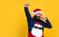Be positive. xmas shopping time. prepare gifts and presents. karaoke. happy bearded man in santa claus hat sing in Royalty Free Stock Photo