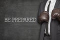 Be prepared on blackboard with businessman Royalty Free Stock Photo