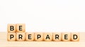 Be prepared phrase in wooden blocks on table. Copy space Royalty Free Stock Photo