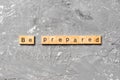 BE PREPARED word written on wood block. BE PREPARED text on cement table for your desing, concept Royalty Free Stock Photo