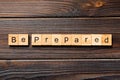 BE PREPARED word written on wood block. BE PREPARED text on wooden table for your desing, concept Royalty Free Stock Photo