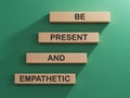 Be Present and Empathetic symbol. Concept words Be Present and Empathetic on wooden blocks.
