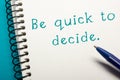 Be quick to decide - Office table top view. Notepad with text and pen