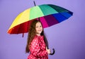 Be rainbow in someones cloud. Rainy day fun. Happy walk under umbrella. Kid girl happy hold colorful rainbow umbrella