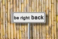 Be right back written on road sign Royalty Free Stock Photo