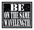 BE ON THE SAME WAVELENGTH, text written on black stamp sign Royalty Free Stock Photo
