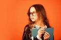 Be smarty. Smart girl brown background. Little girl back to school. Small girl read book in glasses. Primary school girl