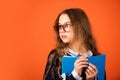 Be smarty. Smart girl brown background. Little girl back to school. Small girl read book in glasses. Primary school girl