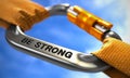 Be Strong on Chrome Carabine with a Orange Ropes Royalty Free Stock Photo