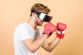 Be strong. man in VR glasses. Futuristic gaming. vr boxing. future innovation. modern gadget. Training boxing game