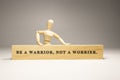 Be a warrior, not a worrier written on wooden surface. Motivation and personal development