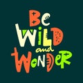 Be wild and wonder hand drawn vector phrase lettering. Isolated on green background Royalty Free Stock Photo