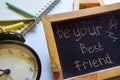 Be your best friend phrase colorful handwritten on chalkboard, alarm clock with motivation and education concepts. Royalty Free Stock Photo