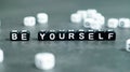 Be yourself slogan in black bead letters. Motivation inspiration self confidence uniqueness concept