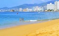 Beach in Acapulco with tourists Royalty Free Stock Photo