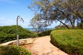 Beach access by pathway with public showers and gardens