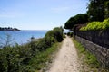 Beach access walking pathway in arzon coast ocean atlantic vannes french brittany in France Royalty Free Stock Photo