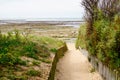 Beach access wooden pathway of atlantic sea in sand dunes with ocean in isle oleron island France southwest Royalty Free Stock Photo