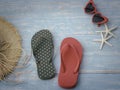 Beach accessories on blue wooden plank summer holiday on the beach concept hat red sunglasses seashell and starfish. Royalty Free Stock Photo