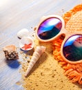 Beach accessories glasses hat cockleshells Royalty Free Stock Photo