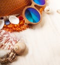 Beach accessories glasses hat cockleshells on wood deck Royalty Free Stock Photo