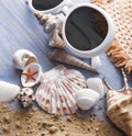 Beach accessories glasses hat cockleshells on wood deck Royalty Free Stock Photo