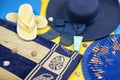 Beach accessories on pastel backgrounds - sunglasses, hat, towel, flip-flops, fan and sunscreen Royalty Free Stock Photo