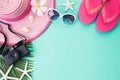 Beach accessories retro film camera, sunglasses, flip flop, starfish beach hat and sea shell on bright pastel green background for Royalty Free Stock Photo