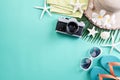 Beach accessories retro film camera, sunglasses, flip flop starfish beach hat and sea shell on green pastel background for summer Royalty Free Stock Photo