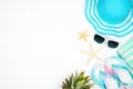 Side border of summer vacation beach accessories on a white wood background with copy space Royalty Free Stock Photo