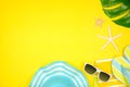 Summer vacation beach accessories corner border on a yellow background with copy space Royalty Free Stock Photo