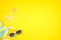 Summer vacation beach accessories side border on a yellow background with copy space Royalty Free Stock Photo