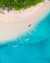 Beach aerial view on the Gold Coast. Nice top view of the blue ocean, people on canoe, white sand and people enjoying a walk. Royalty Free Stock Photo