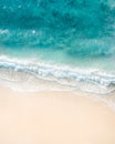 Beach aerial view. Nice top view of the blue ocean, crashing wave and white sand. Royalty Free Stock Photo