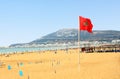 Beach in Agadir with flag of Morocco Royalty Free Stock Photo