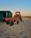 Beach in Ahlbeck with red tractor with trailer. Germany Royalty Free Stock Photo