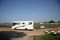 The beach and American style camping car parked on the beach at at Bosham England.