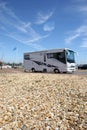 The beach and American style camping car parked on the beach near Bosham, England. Royalty Free Stock Photo