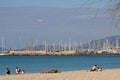 Beach in arenal, palma de mallorca, balearic islands, spain, with hotels in the background and an airplane approaching the airport Royalty Free Stock Photo