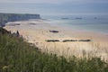 Beach of Arromanches with remains of Mulberry Harbour Royalty Free Stock Photo